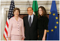 Mrs. Laura Bush and daughter, Barbara Bush, are greeted by Italian Prime Minister Silvio Berlusconi, Thursday, Feb. 9, 2006 at the Villa Madama in Rome.