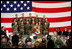 Mrs. Laura Bush addresses an audience of U.S.troops during a visit to Aviano Air Base, in Aviano, Italy, Friday, Feb. 10, 2006.