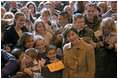 Mrs. Laura Bush meets children and poses for photos during her visit to Aviano AIr Base in Aviano, Italy, Friday, Feb. 10, 2006.