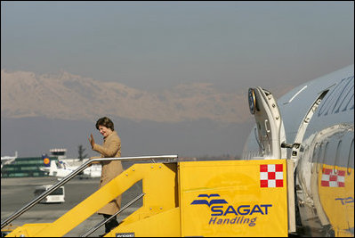 Laura Bush waves upon her arrival in Turin, Italy, Friday, Feb. 10, 2006 for the 2006 Winter Olympics Opening Ceremony.