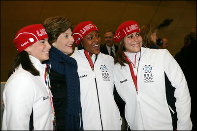 Laura Bush poses for photos with 2006 U.S. Winter Olympic athletes in Turin, Italy, Friday, Feb. 10, 2006 before the Opening Ceremony.