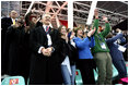 Laura Bush, her daughter, Barbara, and members of the U.S. Olympic Delegation, cheer on American Speed Skater Chad Hedrick Saturday, Feb. 11, 2006, during his heat at the 2006 U.S. Winter Olympics, in Turin, Italy. Hedrick went on to win the first gold medal for the United States.