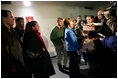 Laura Bush flanked by members of the U.S. Olympic Delegation, (from left) Roland Betts, Dr. Debi Thomas, Herschel Walker and Dr. Eric Heiden meet with members of the press after watching the Men’s U.S. Speed Skating competition at the 2006 Winter Olympics in Turin, Italy.