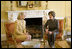 Laura Bush shares a moment with Nane Annan, wife of UN Secretary General Kofi Annan, Monday, Feb. 13, 2006, during a morning meeting in the private residence at the White House.