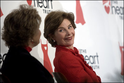 Laura Bush sits with Lois Ingland, a heart disease survivor, during an event at the Carolinas Medical Center Wednesday, Feb. 15, 2006, in Charlotte, NC. The four key risk factors of women with heart disease are smoking, obesity, high blood pressure, and high cholesterol.