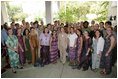 Mrs. Laura Bush poses with Peace Corps volunteers Tuesday, Jan. 17, 2006, at the home of the U.S. Ambassador in Accra, Ghana. Ghana was the first assignment for the organization, which marks its 45th anniversary this year.