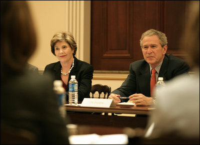 President George W. Bush and Mrs. Bush listen during meeting with heads of foundations to help aid Gulf Coast Recovery at the White House, Thursday, Jan. 19, 2006.