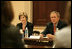 President George W. Bush and Mrs. Bush listen during meeting with heads of foundations to help aid Gulf Coast Recovery at the White House, Thursday, Jan. 19, 2006.