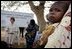 Mrs. Bush sits outside at Saint-Mary's Catholic Hospital in Gwagwalada, Nigeria Wednesday, Jan. 18, 2006, where she announced a $163 million commitment by the United States to Nigeria to battle AIDS.