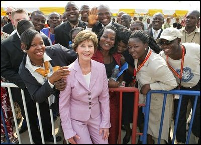 Laura Bush poses with U.S. Embassy workers and their family members, Wednesday, Jan. 18, 2006, during a stop at the U.S. Embassy in Abuja, Nigeria.