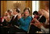 Laura Bush applauds The Moving in the Spirit dancers performance Wednesday, Jan. 25, 2006 in the East Room of the White House, during the President's Committee on the Arts and the Humanities 2006 Coming Up Taller Awards ceremony.