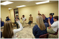 Laura Bush and U.S. Secretary of Education Margaret Spellings meet with staff and students Wednesday, Jan. 26, 2006 at the St. Bernard Unified School in Chalmette, La. Students raise their hands to acknowledge that their families lost everything in the storms of Hurricane Katrina.