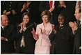 Laura Bush and the invited guets in her box applaud the speech of President George W. Bush, Tuesday evening, Jan. 31, 2006 during the State of the Union Address at United States Capitol in Washington.