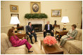 President George W. Bush and Mrs. Laura Bush visit with President Alejandro Toledo of Peru, and his wife and advisor, Mrs. Eliane Karp de Toledo, during a photo opportunity Tuesday, July 11, 2006, in the Oval Office.