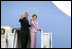 President George W. Bush and Laura Bush wave from Air Force One at Andrews Air Force Base en route to Germany and Russia Wednesday, July 12, 2006. President Bush will meet with Chancellor Angela Merkel in Germany and attend the G8 Summit in St. Petersburg, Russia.