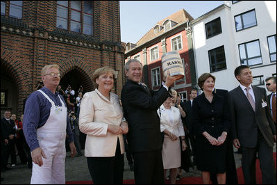 People crowd the town square of Stralsund, Germany, as Chancellor Angela Merkel welcomes President George W. Bush and Laura Bush Thursday, July 13, 2006. "And in 1989, it was also one of the many cities where on Monday demonstrations took place, where people went out into the streets to demand freedom, to demonstrate for freedom," said Chancellor Merkel.