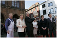 People crowd the town square of Stralsund, Germany, as Chancellor Angela Merkel welcomes President George W. Bush and Laura Bush Thursday, July 13, 2006. "And in 1989, it was also one of the many cities where on Monday demonstrations took place, where people went out into the streets to demand freedom, to demonstrate for freedom," said Chancellor Merkel.