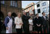 People crowd the town square of Stralsund, Germany, as Chancellor Angela Merkel welcomes President George W. Bush and Laura Bush Thursday, July 13, 2006. "And in 1989, it was also one of the many cities where on Monday demonstrations took place, where people went out into the streets to demand freedom, to demonstrate for freedom," said Chancellor Merkel.