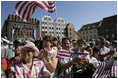 People crowd the town square of Stralsund, Germany, as Chancellor Angela Merkel welcomes President George W. Bush and Laura Bush Thursday, July 13, 2006. "And in 1989, it was also one of the many cities where on Monday demonstrations took place, where people went out into the streets to demand freedom, to demonstrate for freedom," said Chancellor Merkel.