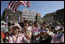 People crowd the town square of Stralsund, Germany, as Chancellor Angela Merkel welcomes President George W. Bush and Laura Bush Thursday, July 13, 2006. "And in 1989, it was also one of the many cities where on Monday demonstrations took place, where people went out into the streets to demand freedom, to demonstrate for freedom," said Chancellor Merkel.