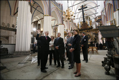 German Chancellor Angela Merkel, President George W. Bush and Laura Bush tour St. Nikolai Church in Stralsund, Germany, Thursday, July 13, 2006.