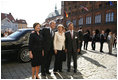 President George W. Bush and Laura Bush participate in an arrival ceremony with German Chancellor Angela Merkel and her husband Joachim Sauer in Stralsund, Germany, Thursday, July 13, 2006.