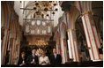 President George W. Bush and Laura Bush stand with German Chancellor Angela Merkel and Pastor Peter Neumann in St. Nikolai Church in Stralsund, Germany, Thursday, July 13, 2006.