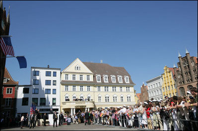 President George W. Bush addresses the crowded town square of Stralsund, Germany, before meeting with Chancellor Angela Merkel Thursday, July 13, 2006. "I bring a message from the American people: We're honored to call the German people friends and allies," said President Bush. "We share common values and common interests. We want to work together to keep the peace. We want to work together to promote freedom. There's so much that we can do, working together, and that's -- part of my visit today is to pledge to you and the Chancellor, America and Germany stand side-by-side."