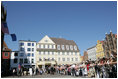 President George W. Bush addresses the crowded town square of Stralsund, Germany, before meeting with Chancellor Angela Merkel Thursday, July 13, 2006. "I bring a message from the American people: We're honored to call the German people friends and allies," said President Bush. "We share common values and common interests. We want to work together to keep the peace. We want to work together to promote freedom. There's so much that we can do, working together, and that's -- part of my visit today is to pledge to you and the Chancellor, America and Germany stand side-by-side."