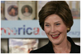 Mrs. Laura Bush speaks to school children during a visit Thursday, July 13, 2006, to the Stralsund Children's Library in Stralsund, Germany, where Mrs. Bush participated in the ribbon cutting to open the exhibit America@yourlibrary. The America@yourlibrary is a new initiative to develop existing and new partnerships between German public libraries and the U.S. Embassy and Consulate Resource Centers.