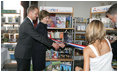 Mrs. Laura Bush speaks to school children during a visit Thursday, July 13, 2006, to the Stralsund Children's Library in Stralsund, Germany, where Mrs. Bush participated in the ribbon cutting to open the exhibit America@yourlibrary. The America@yourlibrary is a new initiative to develop existing and new partnerships between German public libraries and the U.S. Embassy and Consulate Resource Centers.