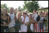 The President greets local residents. Well-wishers line the streets of Trinwillershagen, Germany, Thursday, July 13, 2006, awaiting a glimpse of President George W. Bush and Laura Bush as they arrive for a barbeque with German Chancellor Angela Merkel.