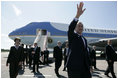 President George W. Bush and Laura Bush arrive Friday, July 14, 2006, to St. Peterburg's Pulkovo Airport, waving to well-wishers waiting to greet them. President Bush will attend the G8 Summit over the weekend.