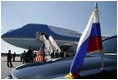 President George W. Bush and Mrs. Laura Bush wave from Air Force One upon arriving at Pulkovo International Airport for the upcoming G8 Summit in St. Petersburg, Russia, Friday, July 14, 2006.