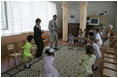 Laura Bush dances with youngsters Friday, July 14, 2006, at the Pediatric HIV/AIDS Clinical Center of Russia in St. Petersburg, Russia.