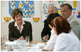 Mrs. Laura Bush listens to roundtable participants Friday, July 14, 2006, during a tour of the Pediatric HIV/AIDS Clinical Center of Russia in St. Petersburg, Russia.