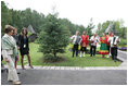 Mrs. Laura Bush and Mrs. Lyudmila Putina are greeted by a traditional Russian Folk group as they arrive at the Podvoriye Restaurant Saturday, July 15, 2006, in St. Petersburg, Russia.