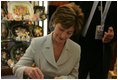 Mrs. Laura Bush participates in an arts and crafts demonstration Monday, July 17, 2006, during an exhibit at the Baltic Star Hotel on the grounds of the Konstantinovsky Palace Complex in Strelna, Russia, site of the G8 Summit that ended Monday.