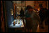 Laura Bush looks over a display piece Monday, July 17, 2006, at a Hermitage Exhibit for G8 spouses at the Konstantinovsky Palace Complex in Strelna, Russia, site of the 2006 G8 Summit that ended Monday.