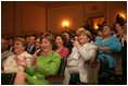 Mrs. Laura Bush applauds the speakers participating in the National Endowment for the Arts Big Read event Thursday, July 20, 2006, at the Library of Congress in Washington. The Big Read is a new program to encourage the reading of classic literature by young readers and adults.