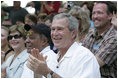 President George W. Bush and Laura Bush are joined by baseball legend and hall of famer Willie Mays, Tee Ball Commissioner for the day Sunday, July 30, 2006, at the Tee Ball on the South Lawn game between the Thurmont Little League Civitan Club of Frederick Challengers of Thurmont, Md., and the Shady Spring Little League Challenger Braves of Shady Spring, W. Va.