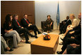 Ms. Barbara Bush talks about her experiences visiting AIDS clinics in Africa with U.S. Ambassador to the U.N. John Bolton, seated at her left, UN Secretary-General Kofi Annan, seated next to Mrs. Bush, and staff members during a visit to the United Nations in New York June 2, 2006. Mrs. Laura Bush also spoke about HIV/AIDS to the United Nations General Assembly's High-Level Meeting on AIDS.