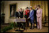 President George W. Bush signs a proclamation to create the Northwestern Hawaiian Islands Marine National Monument at a ceremony Wednesday, June 15, 2006, in the East Room of the White House. The proclamation will bring nearly 140,000 square miles of the Northwestern Hawaiian Island Coral Reef Ecosystem under the nation's highest form of marine environmental protection. Mrs. Laura Bush joined the President and distinguished guests on stage, from left to right, U.S. Rep. Neil Abercrombie, D-Hawaii; U.S. Rep. Ed Case, D-Hawaii; U.S. Sen. Daniel Akaka, D-Hawaii; U.S. Commerce Secretary Carlos Gutierrez; Hawaii Gov. Linda Lingle; documentary filmmaker Jean-Michel Cousteau; marine biologist Sylvia Earle and U.S. Interior Secretary Dirk Kempthorne.