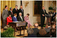 President George W. Bush addresses invited guests in the East Room of the White House prior to signing a proclamation to create the Northwestern Hawaiian Islands Marine National Monument, Wednesday, June 15, 2006.The proclamation will bring nearly 140,000 square miles of the Northwestern Hawaiian Island Coral Reef Ecosystem under the nation's highest form of marine environmental protection. Mrs. Laura Bush joined the President and distinguished guests on stage, seated from left to right, Hawaii Gov. Linda Lingle; marine biologist Sylvia Earle; and documentary filmmaker Jean-Michel Cousteau, Standing ,left to right, are U.S. Rep. Ed Case, D-Hawaii; U.S. Sen. Daniel Akaka, D-Hawaii; U.S. Commerce Secretary Carlos Gutierrez and U.S. Interior Secretary Dirk Kempthorne.