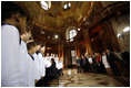 President George W. Bush and Mrs. Laura Bush listen to the Vienna Boys Choir at the National Library at Hofburg Palace in Vienna, June 21, 2006.