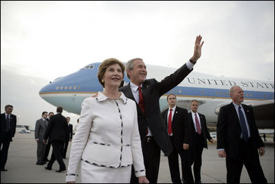 President George W. Bush waves as he and Laura Bush arrive at Budapest-Ferihegy Airport in Budapest Wednesday night, June 21, 2006, on the last leg of their journey to Europe.