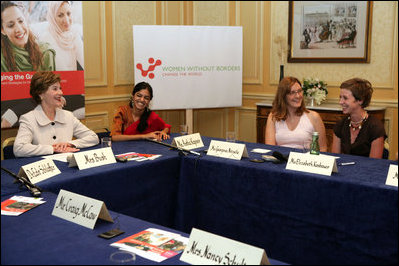 Mrs. Laura Bush participates in a roundtable discussion with members of Women Without Borders, a Vienna-based human rights organization, Wednesday, June 21, 2006 in Vienna, Austria. Seen with Mrs. Bush are, from left to right, Astha Kapoor, Georgina Nitische and Elizabeth Kasbauer.