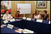 Mrs. Laura Bush participates in a roundtable discussion with members of Women Without Borders, a Vienna-based human rights organization, Wednesday, June 21, 2006 in Vienna, Austria. Seen with Mrs. Bush are, from left to right, Astha Kapoor, Georgina Nitische and Elizabeth Kasbauer.