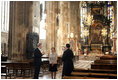 Mrs. Laura Bush admires the architecture of St. Stephen's Cathedral in Vienna, Austria, Wednesday, June 21, 2006, during a tour guided by Bernd Kolodziejczak, left, and Father Timothy McDonnell, right. The cathedral is of one of Vienna's most famous sights built in 1147 AD.