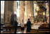 Mrs. Laura Bush admires the architecture of St. Stephen's Cathedral in Vienna, Austria, Wednesday, June 21, 2006, during a tour guided by Bernd Kolodziejczak, left, and Father Timothy McDonnell, right. The cathedral is of one of Vienna's most famous sights built in 1147 AD.